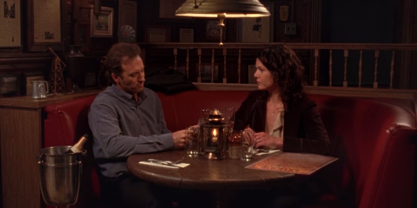 Luke and Lorelai At A Restaurant talking in Gilmore Girls.