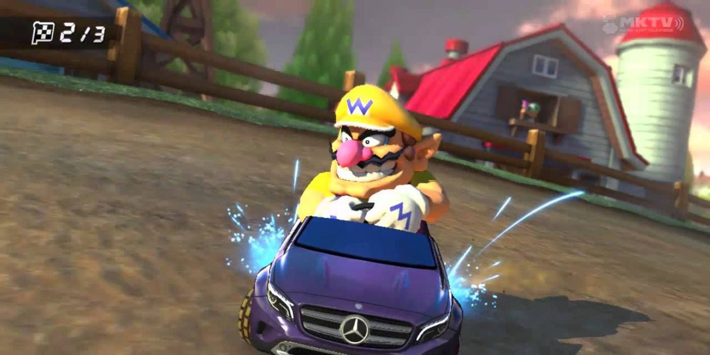 Wario melayang di dalam mobil Mercedes GLA di Mario Kart 8.