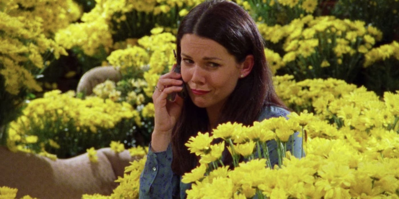 Lorelai Sitting Surrounded By Yellow Daisies in Gilmore Girls.