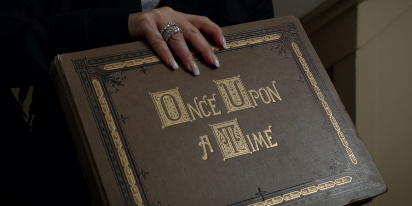 A woman holds a storybook as seen in Once Upon a Time.