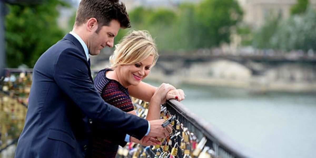 Ben and Leslie putting a lock on a Parisian bridge in Parks and Recreation