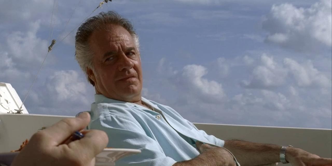 Paulie on a boat looking at Tony