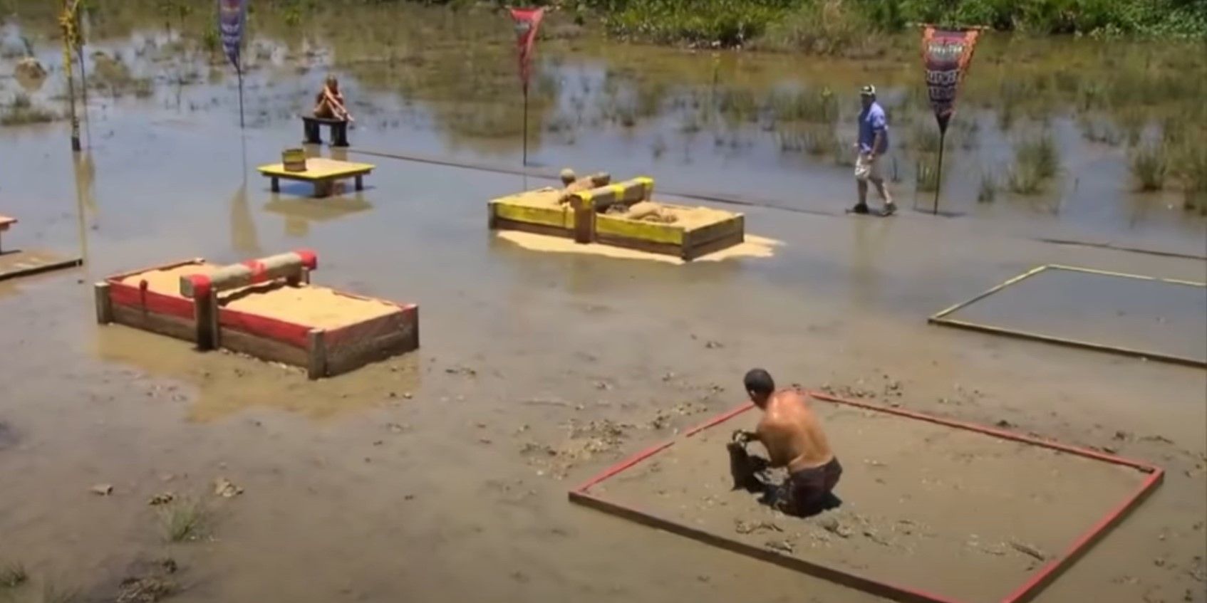 Penner digging in the mud in the Muddy Waters challenge on Survivor: Philippines