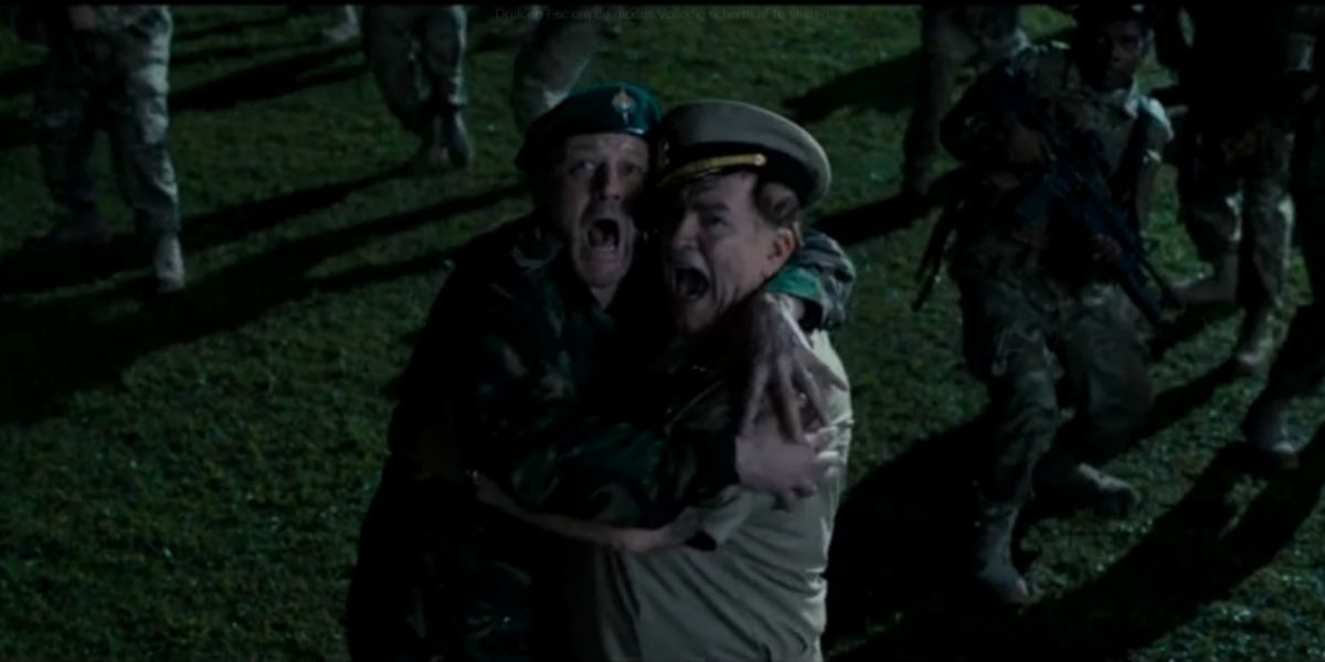 Corporal Hill and Admiral Porter embrace and scream in fear in Pixels