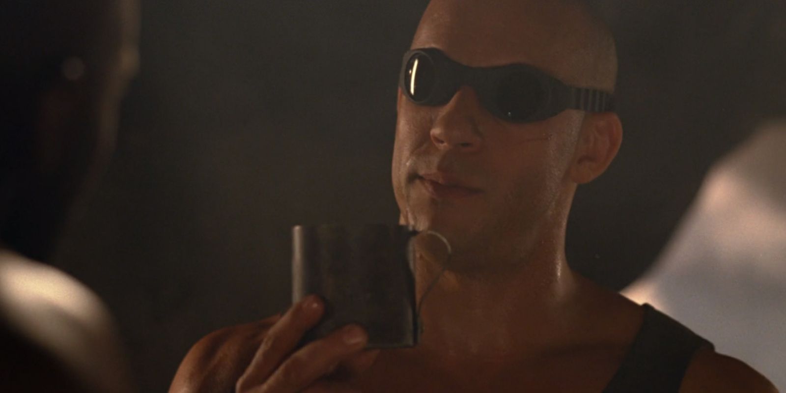 Riddick threatening an inmate with a teacup in The Chronicles Of Riddick