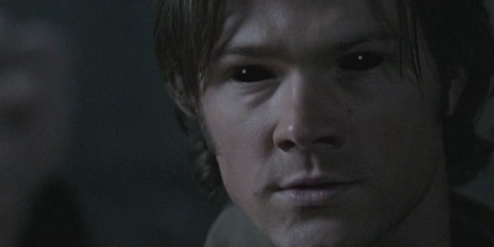 Sam Winchester from Supernatural with demonic black eyes