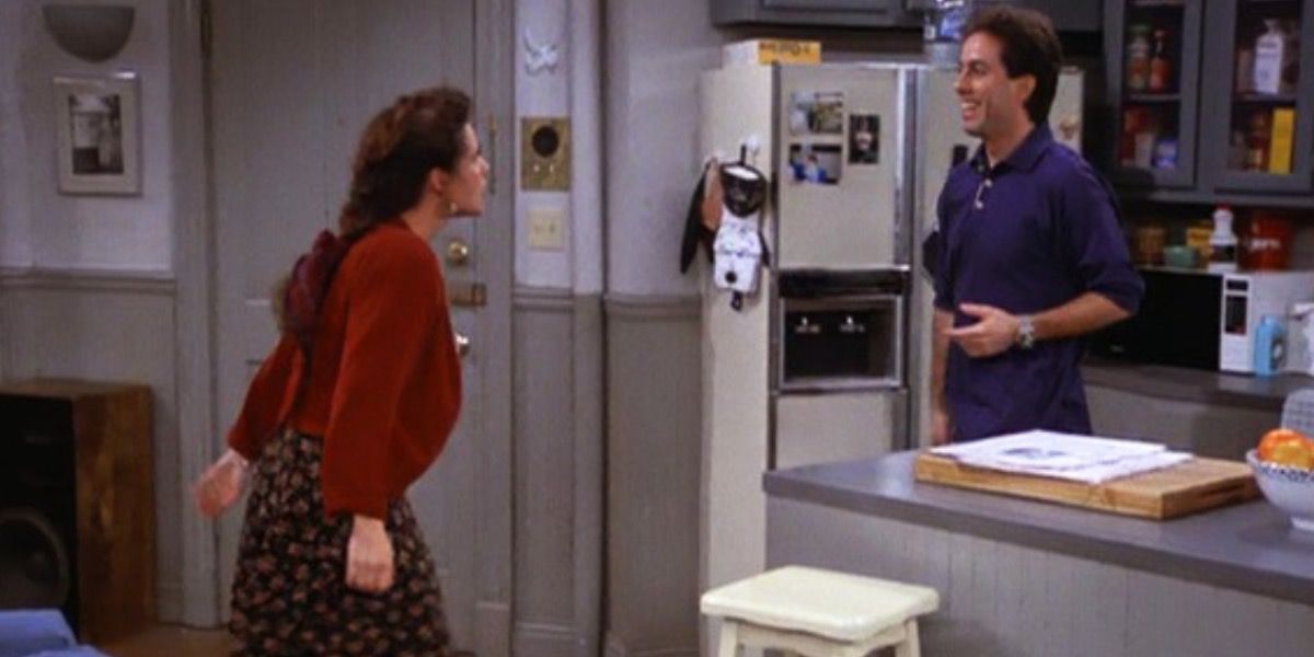 Seinfeld — Elaine about to shove Jerry into his kitchen