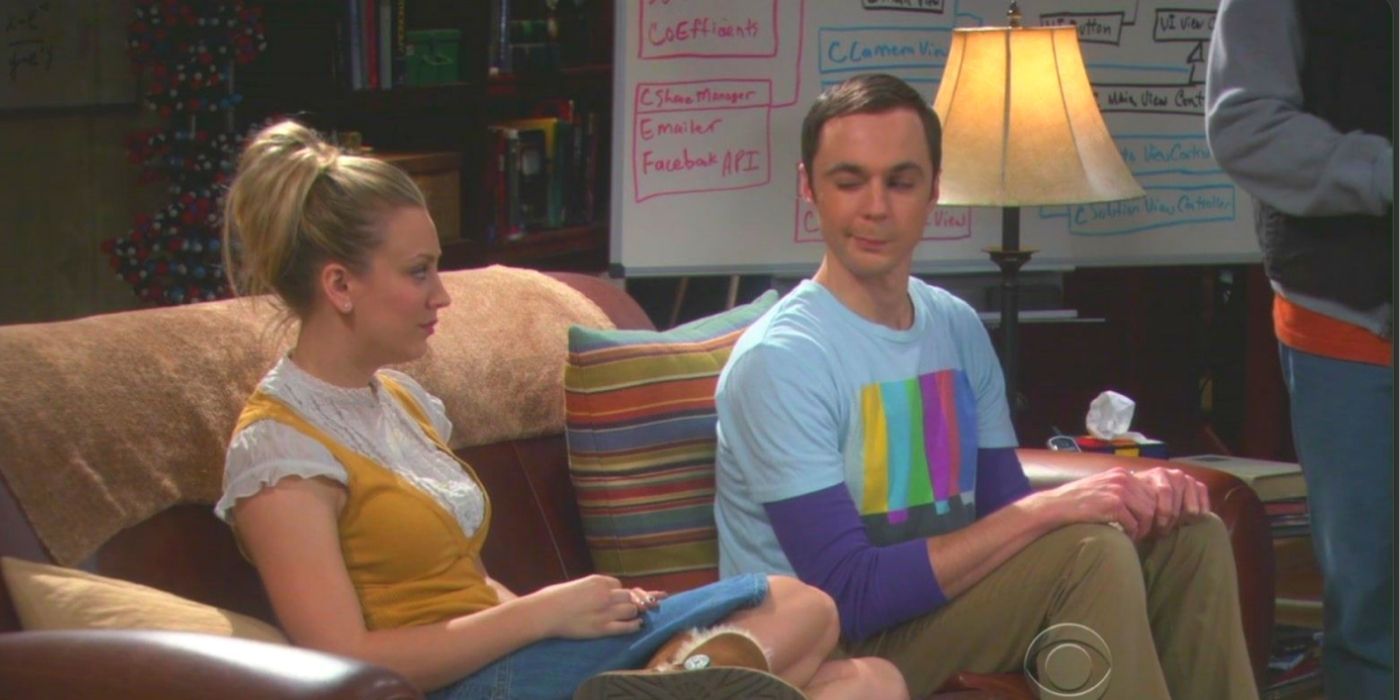 Sheldon sitting on the couch giving Penny a wink on TBBT