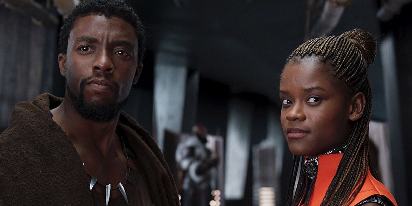 Shuri standing by her brother Black Panther.
