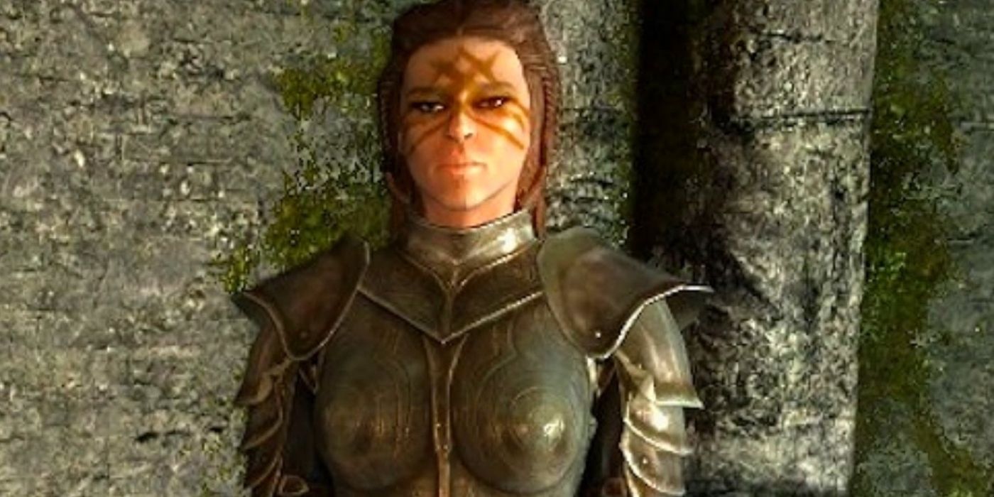 A woman in armor stands in a room in Skyrim