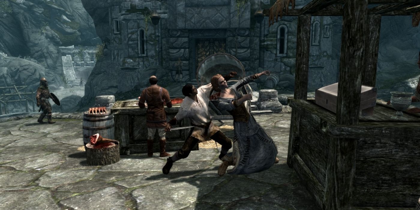 A male character attacks a female character in Skyrim
