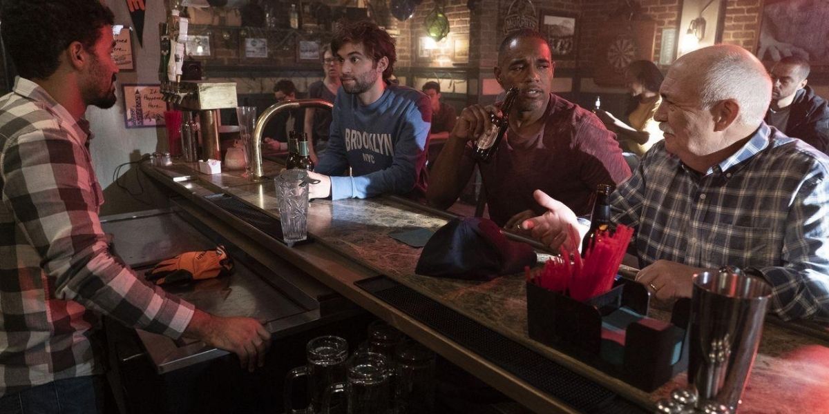 Three men sitting in a bar in Station 19