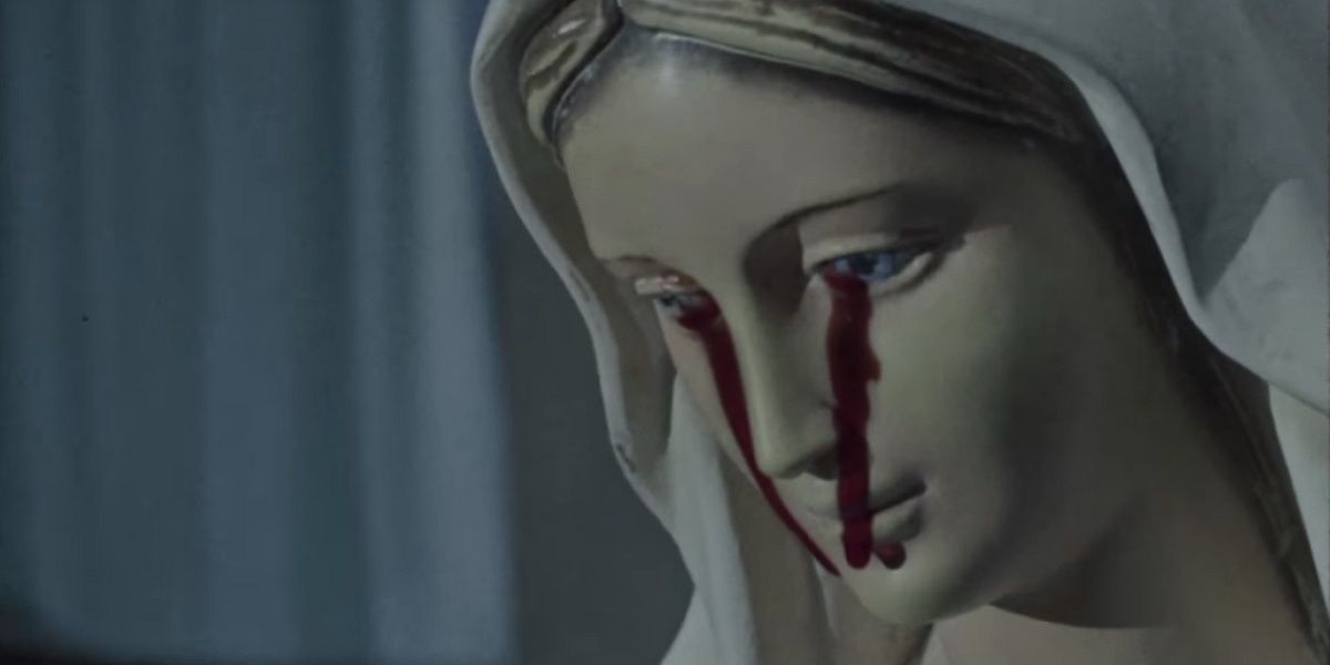 Statue of Virgin Mary with blood flowing out of her eyes in The Devil's Doorway