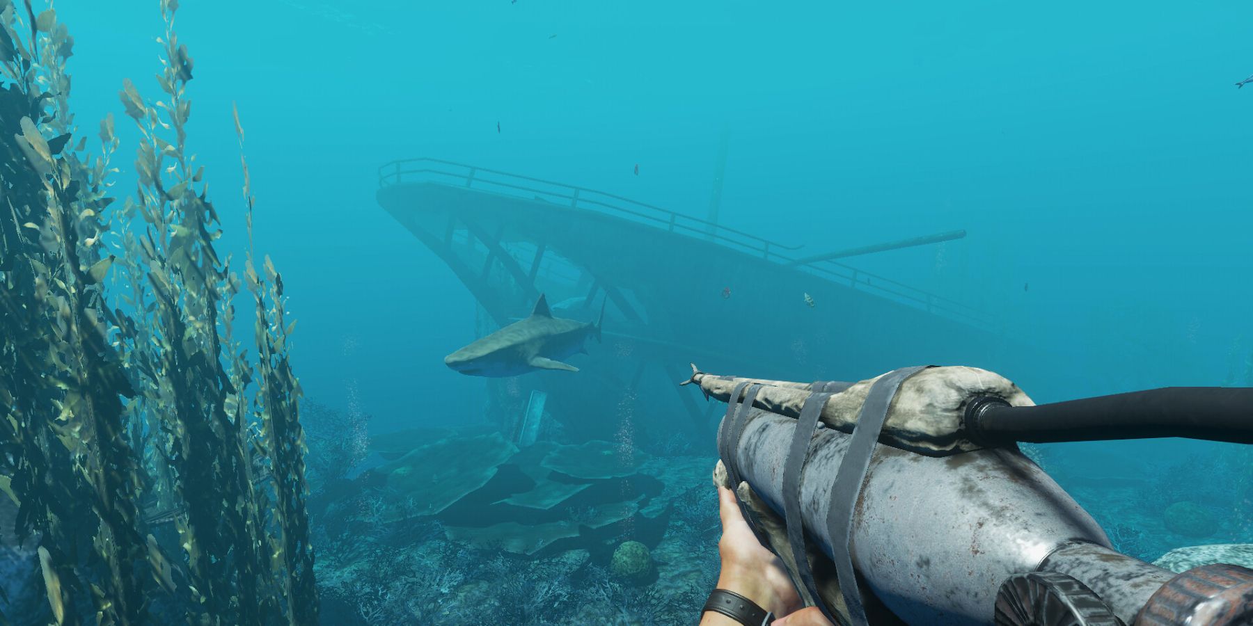 The player holding a harpoon gun aiming at a shark in Stranded Deep game.