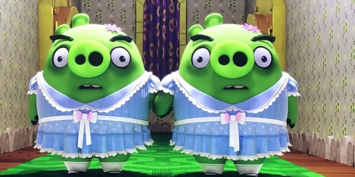Two green pigs dressed as the Grady twins in The Angry Birds Movie