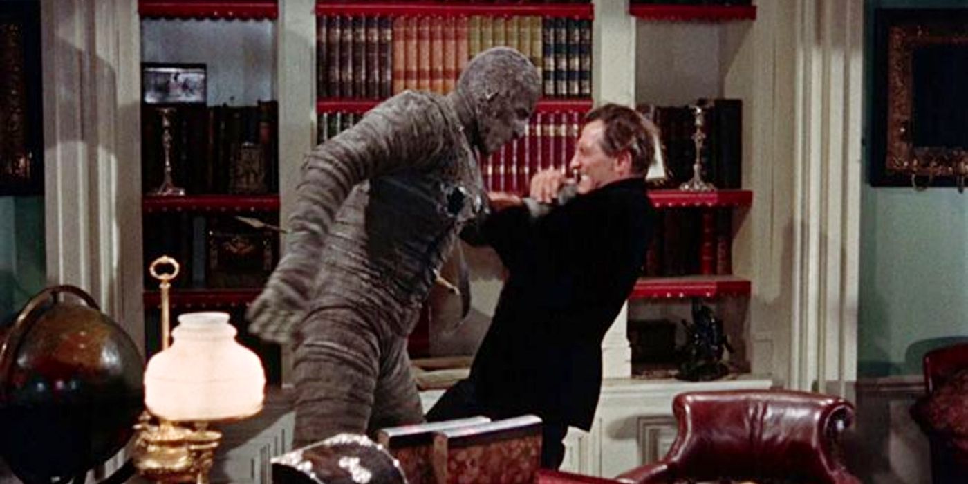 Peter Cushing is attacked by a mummy in The Mummy.