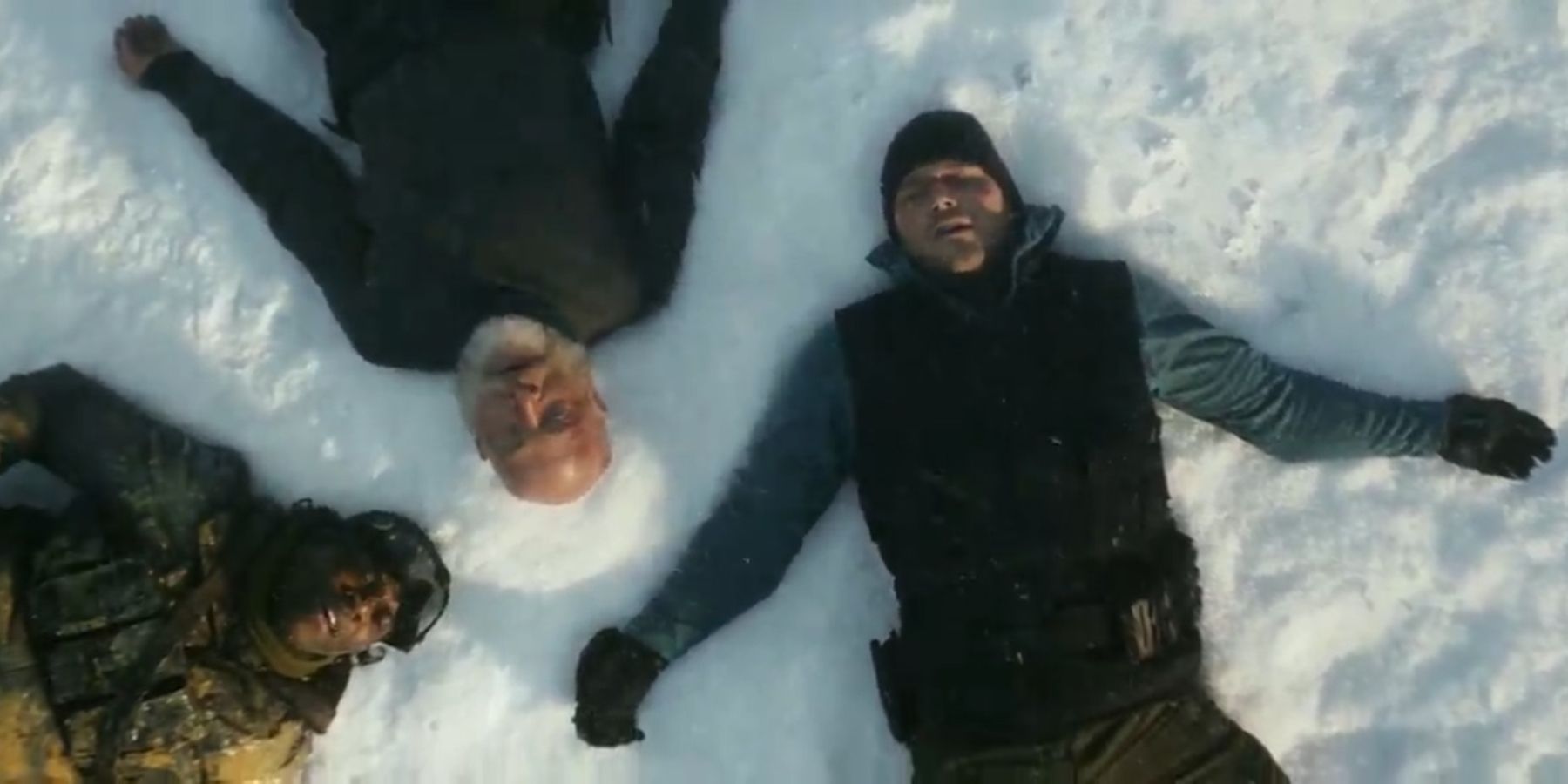 James. Dan, and Charles laying down in the snow after defeating the female whitespike