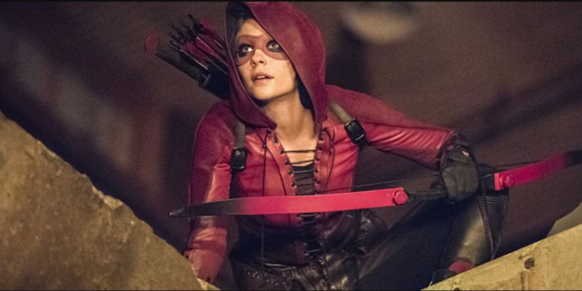 Thea dressed as Speedy with a bow and arrows on Arrow