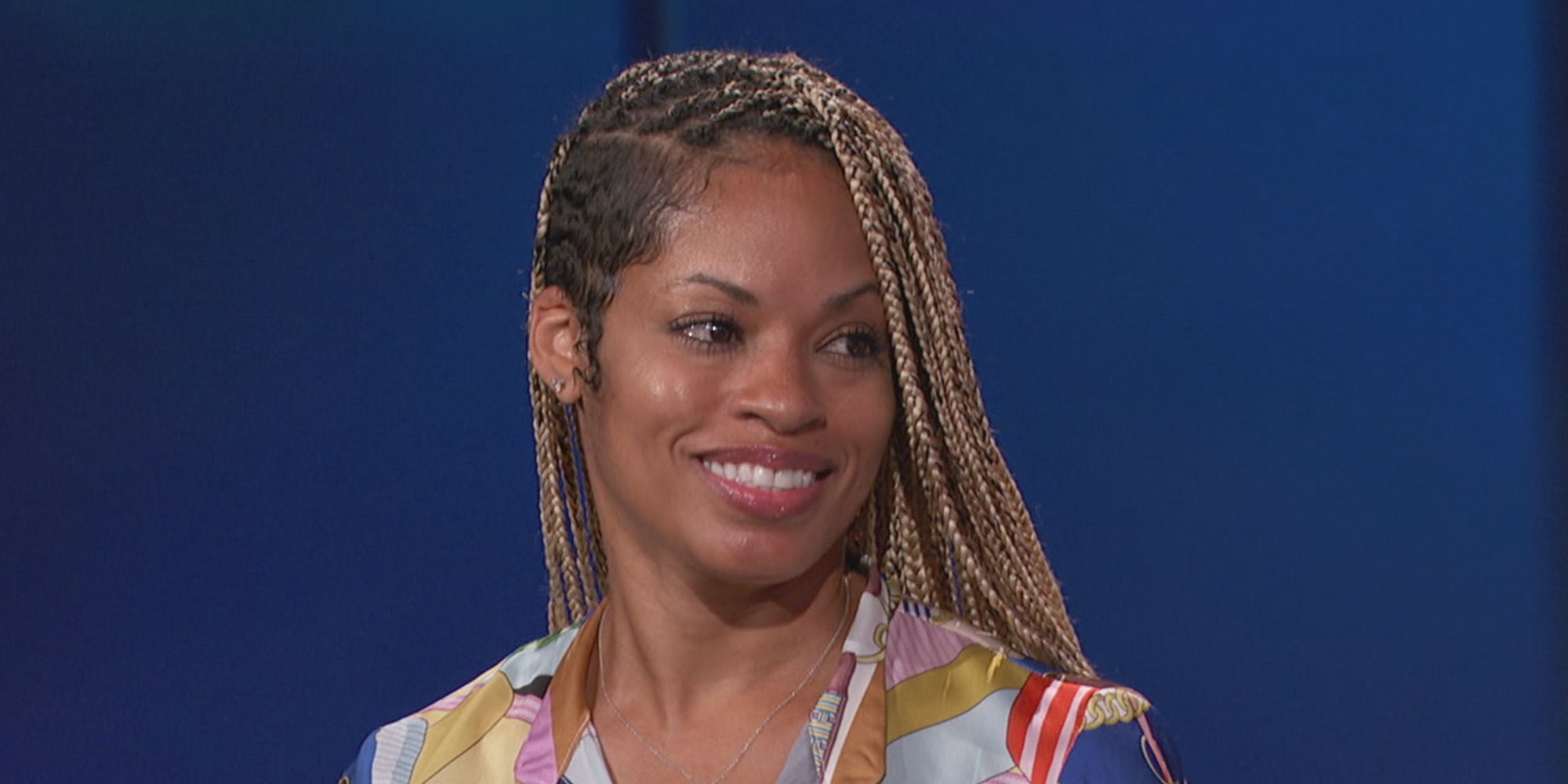 Tiffany Mitchell smiling and looking to her left in Big Brother.