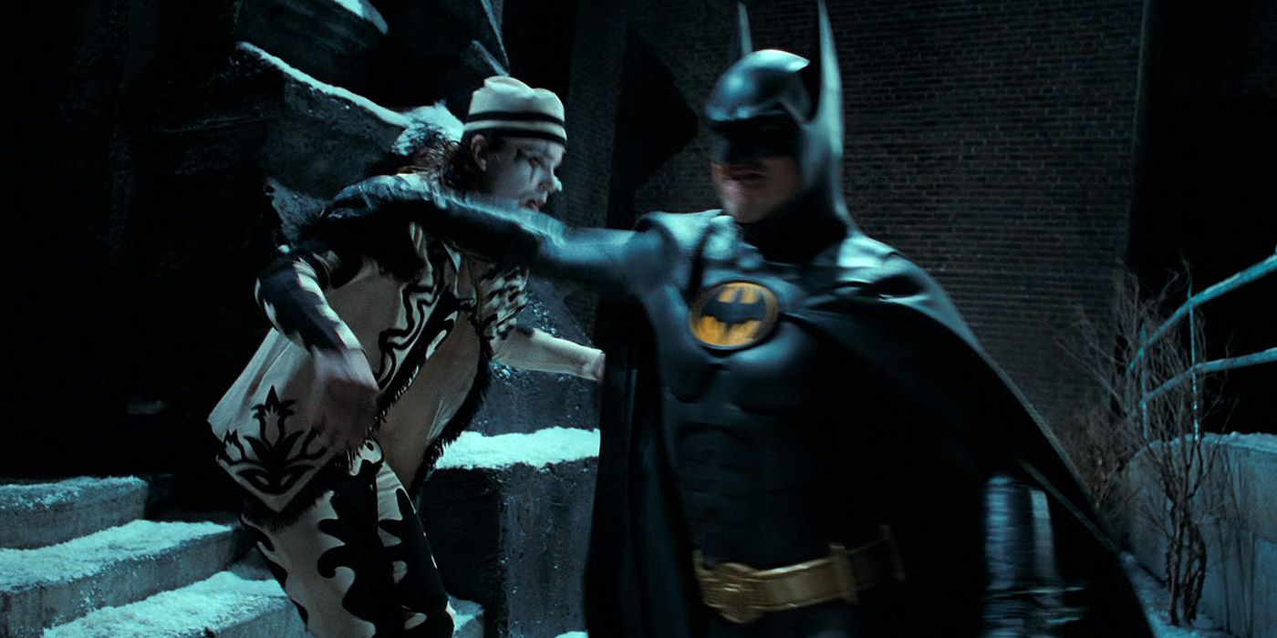 Batman punches a Red Triangle Circus gang member in Batman Returns