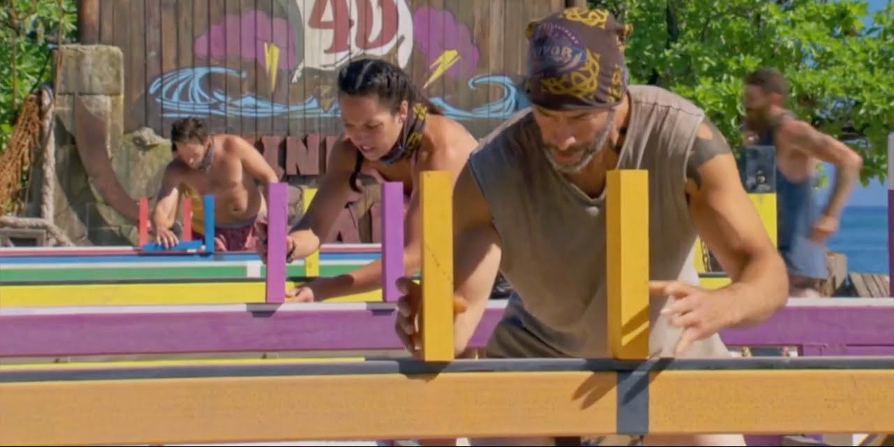 The Survivor: Winners At War cast setting up dominoes