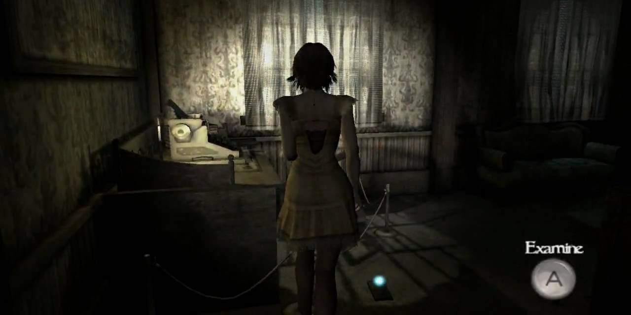 Ruka standing in a dark room in front of a desk