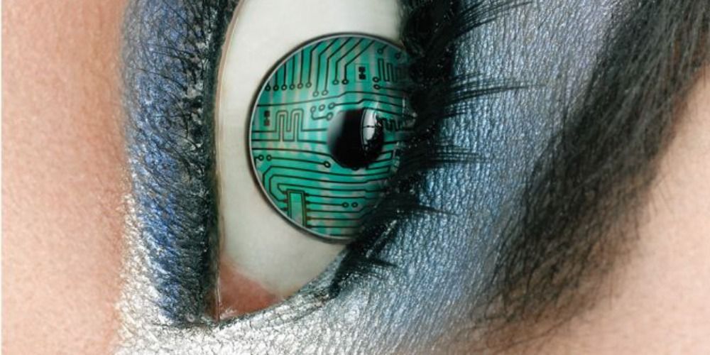 a close up of an eye, the iris is green and looks like a computer motherboard, the eye has silver makeup and black eyeliner surrounding it