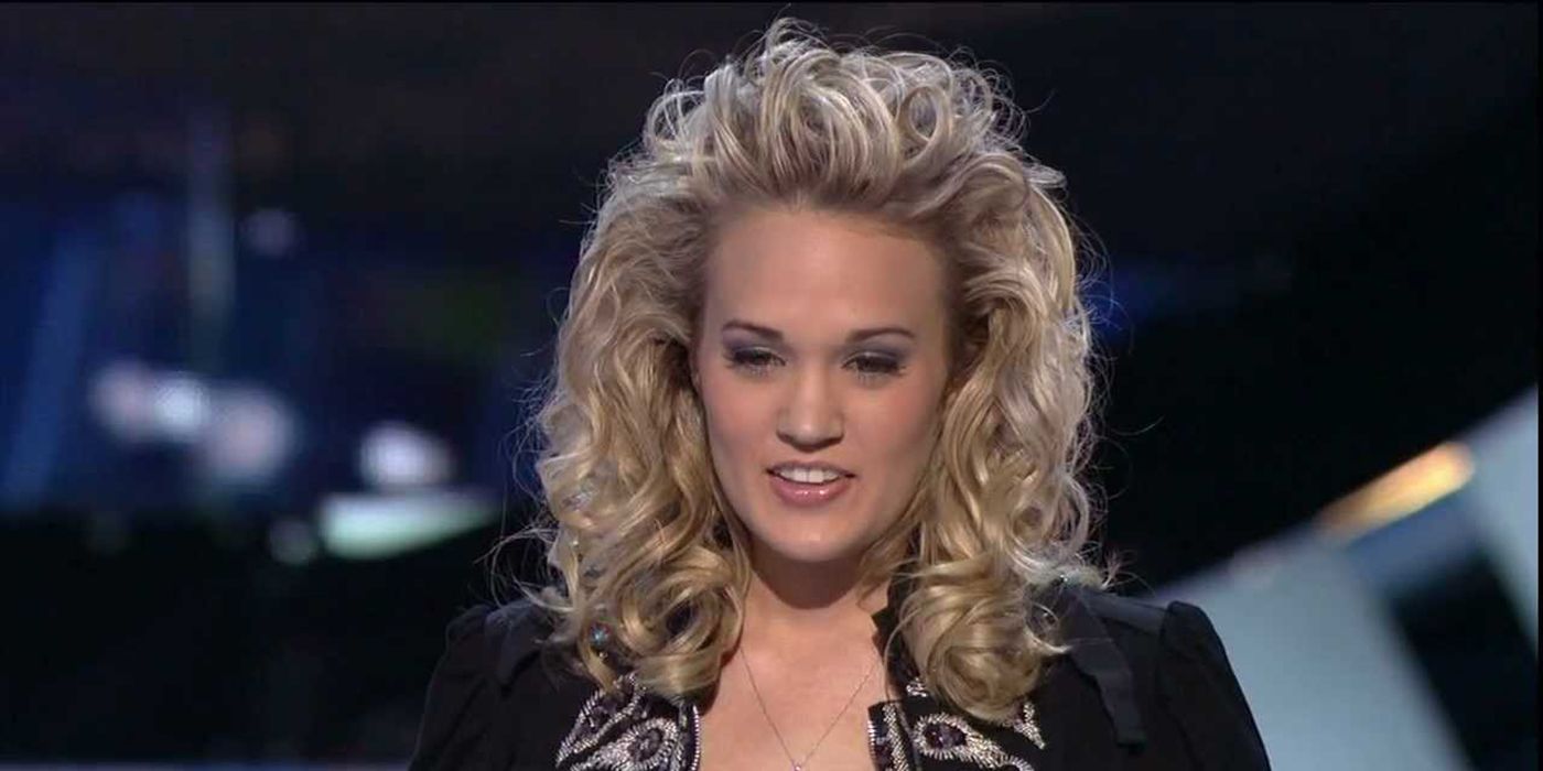 Carrie Underwood with teased hair on the American Idol stage.