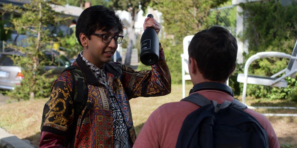Zahid holds wine bottle in Atypical