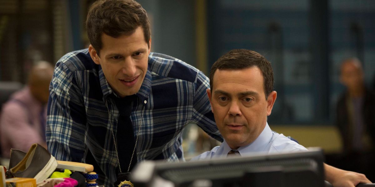 Jake and Charles looking at a computer screen on Brooklyn Nine-Nine