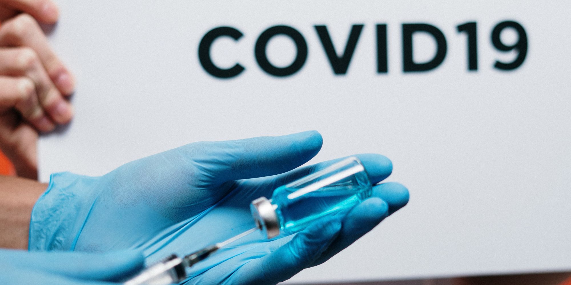 Photo of someone administering a COVID-19 vaccine