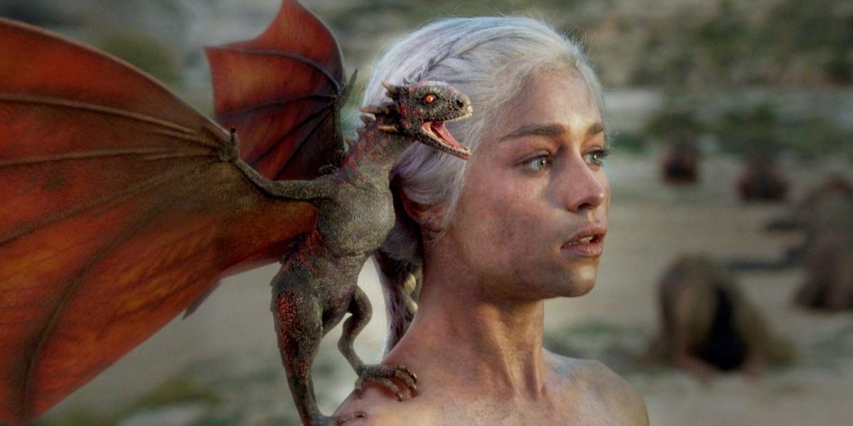 Daenerys with a baby dragon after surviving a fire on Game of Thrones