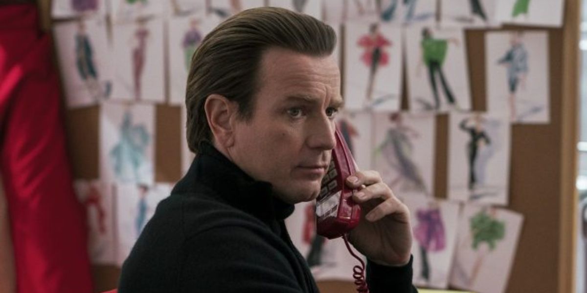 Halston taking a call in his office on Netflix's Halston.