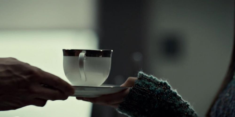 Hannibal hands Abigail a teacup