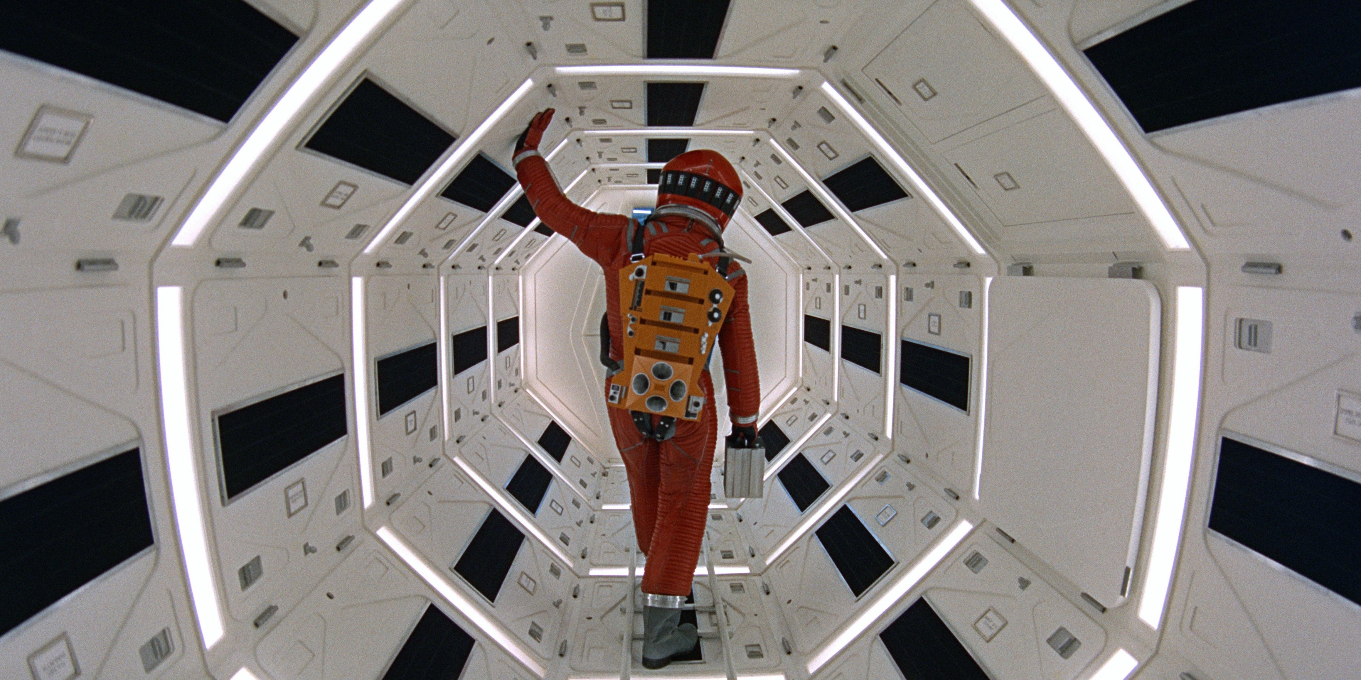 iconic shot from 2001 A Space Odyssey showing Keir Dullea as an astronaut inside a lit spaceship