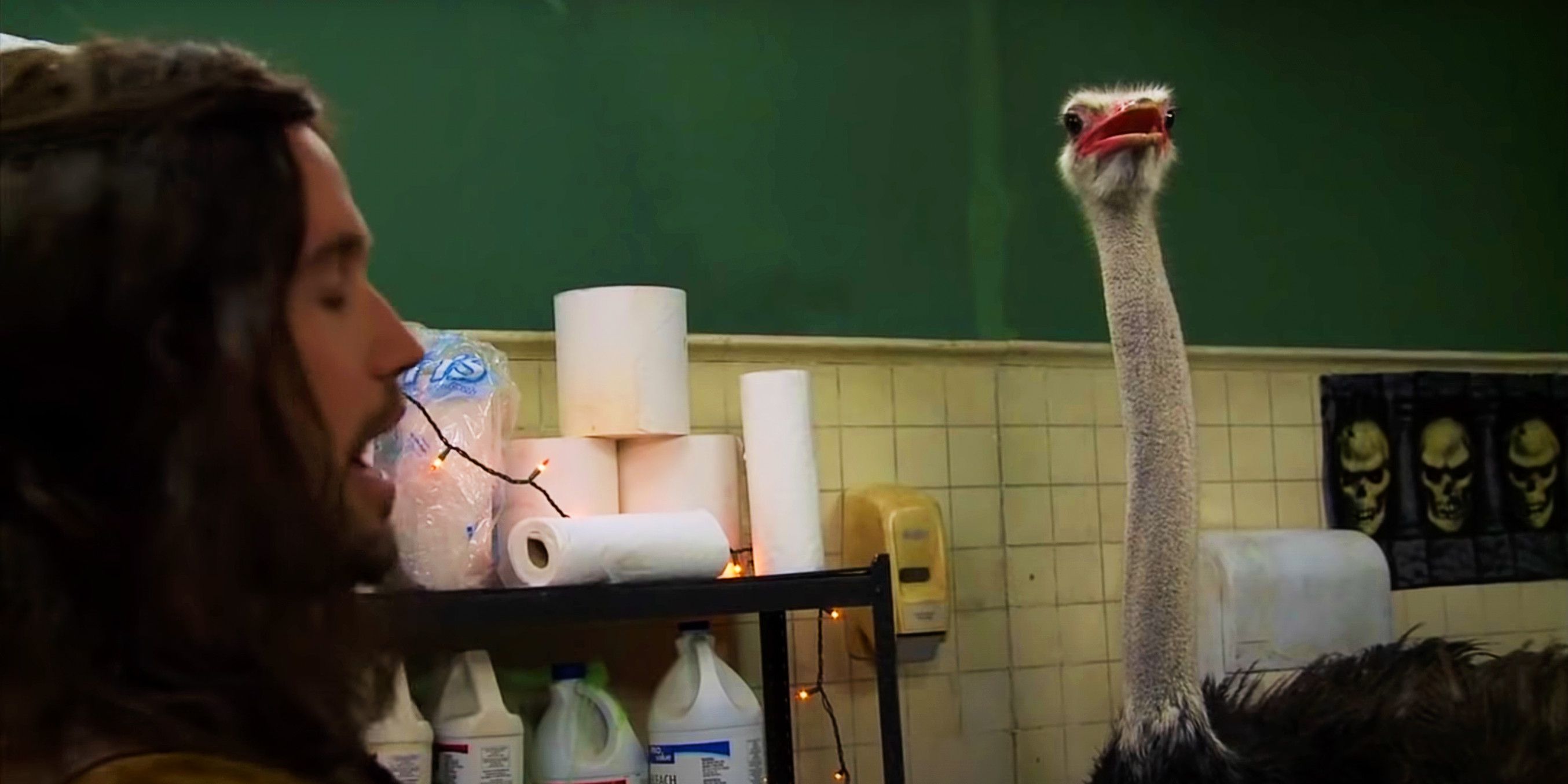 Mac stands in front of an ostrich in It's Always Sunny in Philadelphia "Dee Gives Birth"