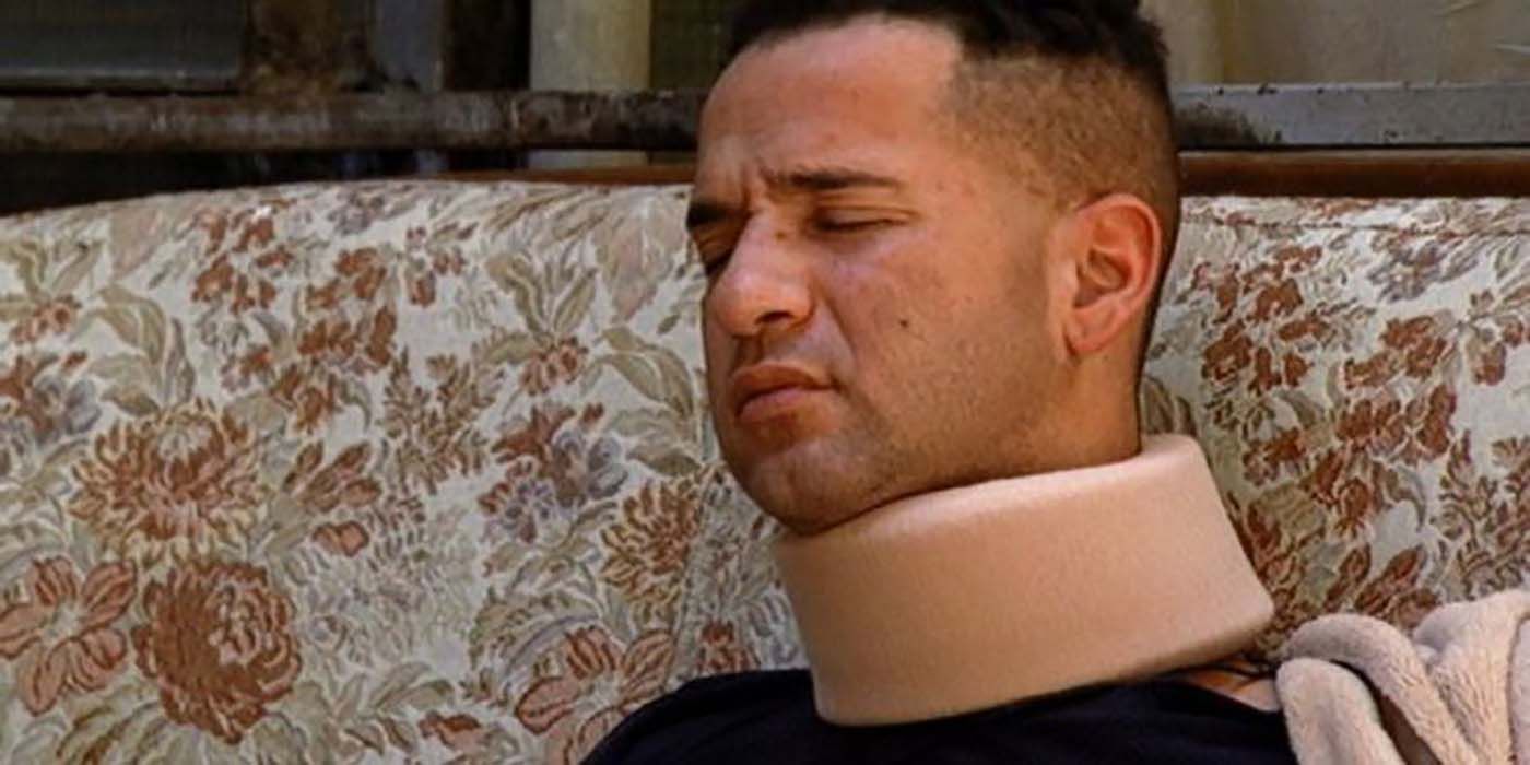 Mike in pain wearing a neck brace on Jersey Shore.