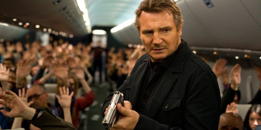 Bill holds gun on airplane in Non-Stop.