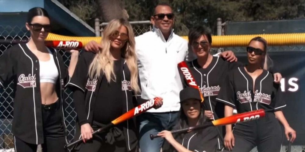 Kendall, Khloe, ARod, Kris, and Kim posing with softball bats in Keeping Up With The Kardashians