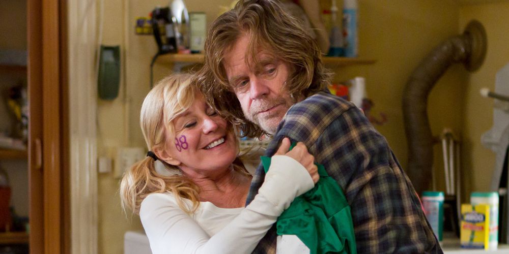 Frank and Monica dance in kitchen in Shameless