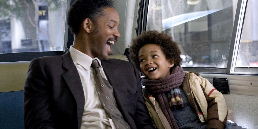Chris and Chris Jr. rejoice on bus in The Pursuit of Happyness