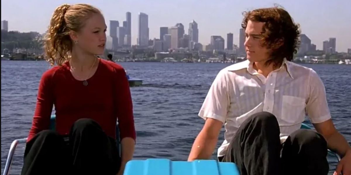 Kat and Patrick sitting on the water in 10 Things I Hate About You