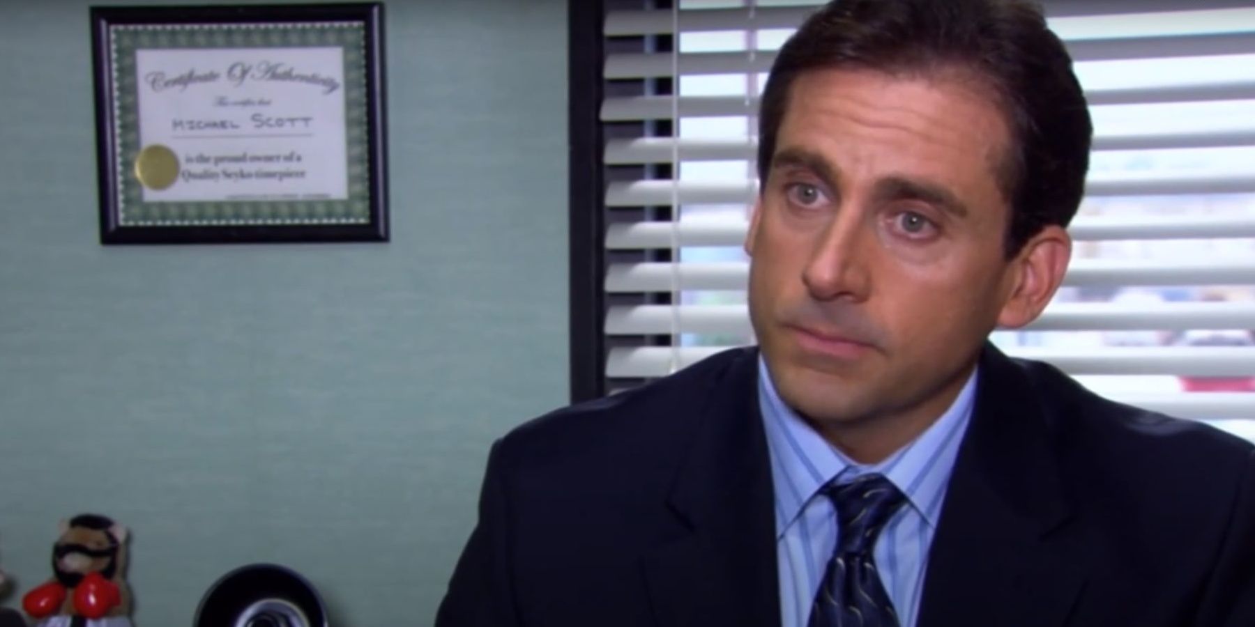 An upset Michael stares at the camera in The Office