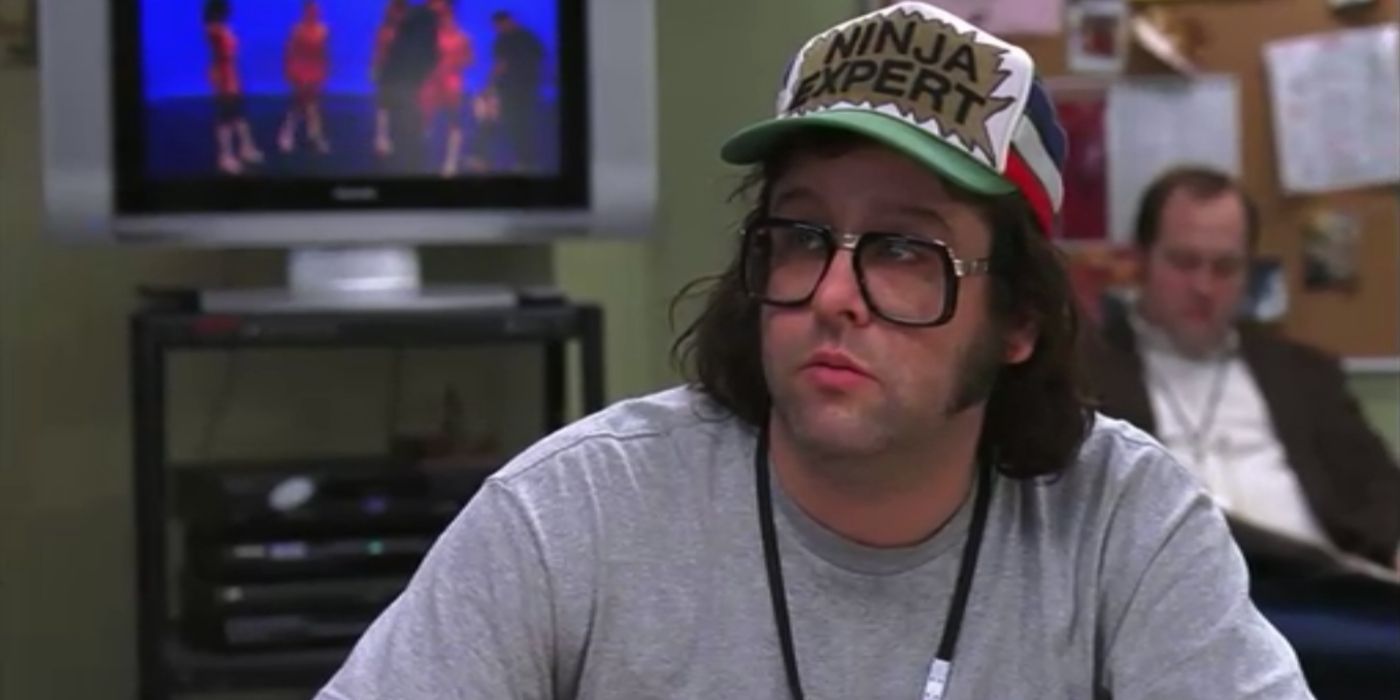Frank wearing a hat that says Ninja Expert in 30 Rock