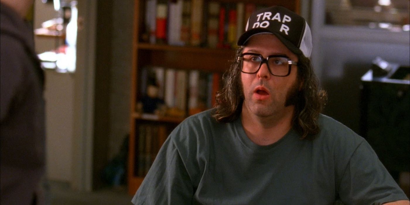 Frank wearing a hat that says Trap D-or in 30 Rock
