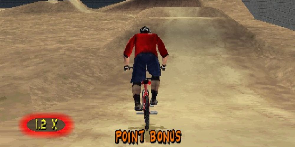Rider approaches a dirt mound in TJ Lavin&rsquo;s Ultimate BMX video game