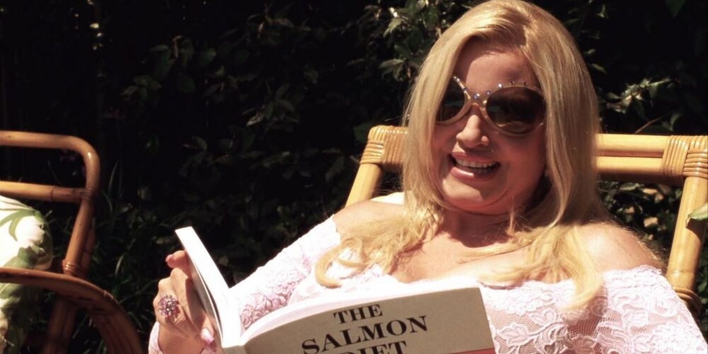 Fiona reading a book at her pool in A Cinderella Story