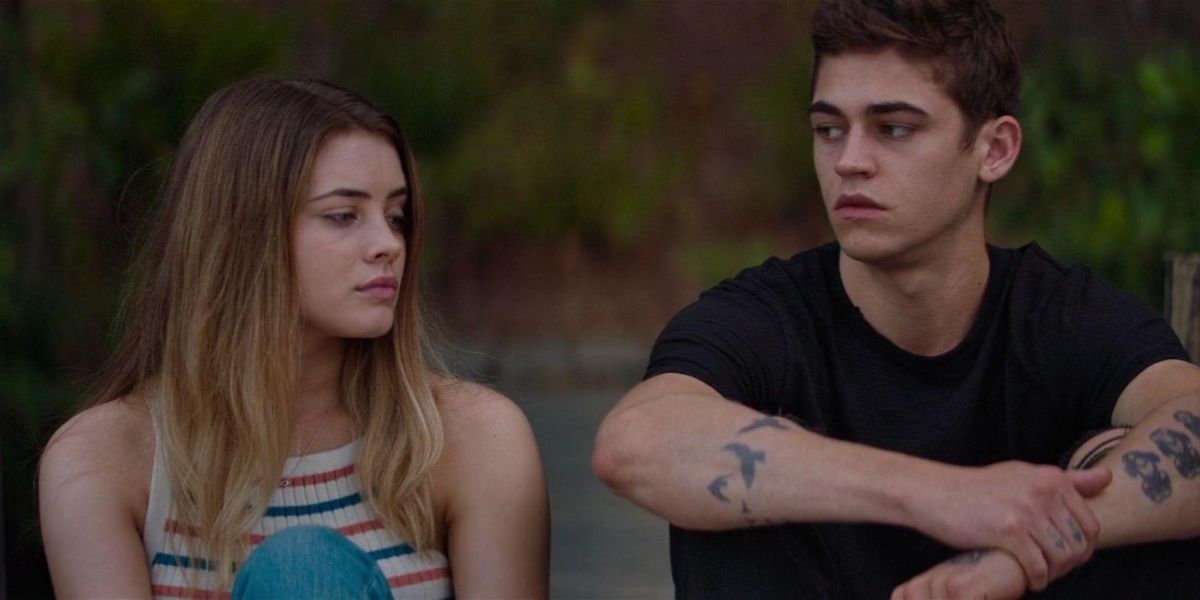 Hardin and Tessa sitting on a bridge in After