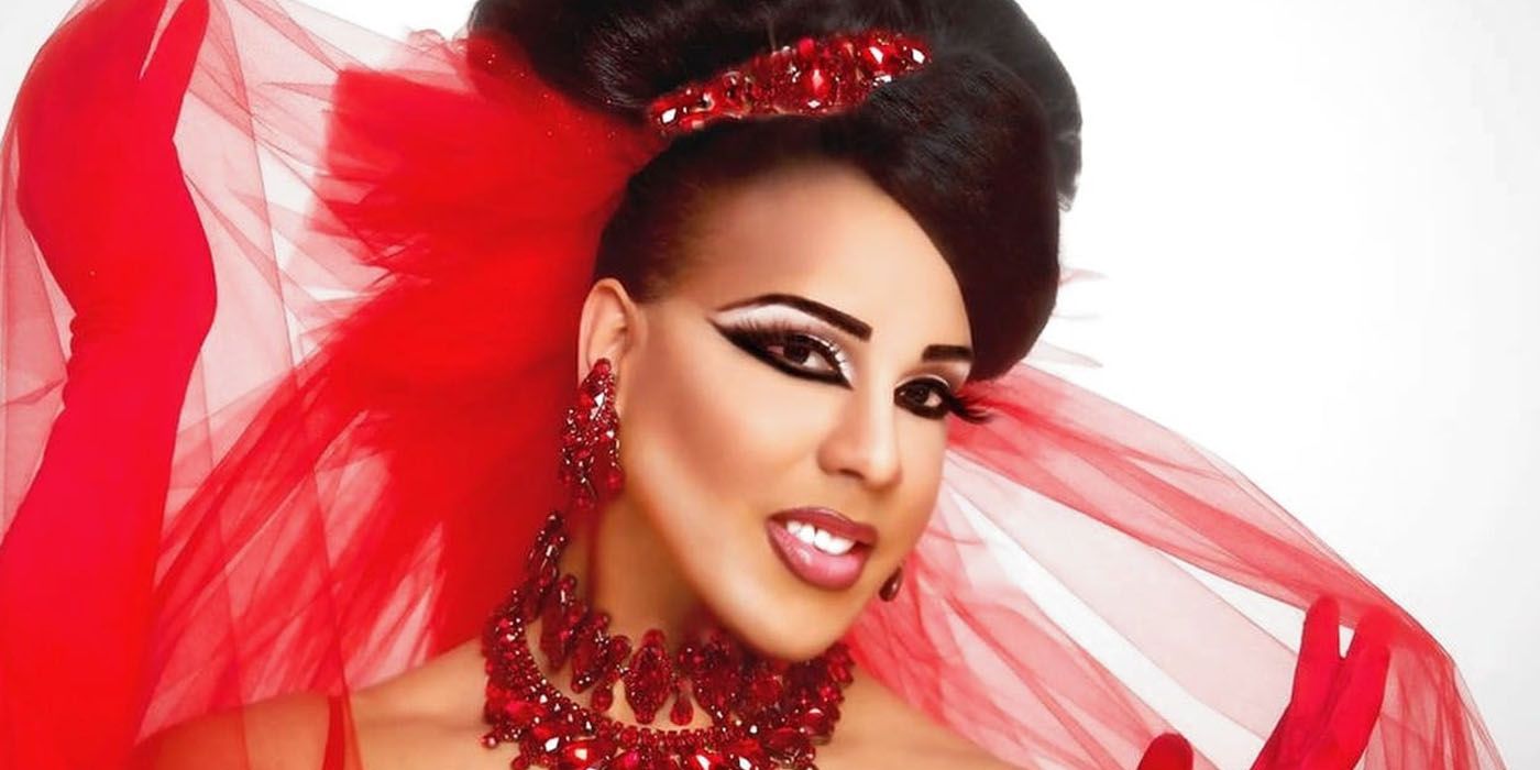 Alexis Mateo poses in a red gown in RuPaul's Drag Race.