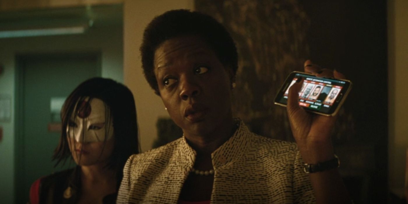 Amanda Waller holding the bomb trigger in The Suicide Squad